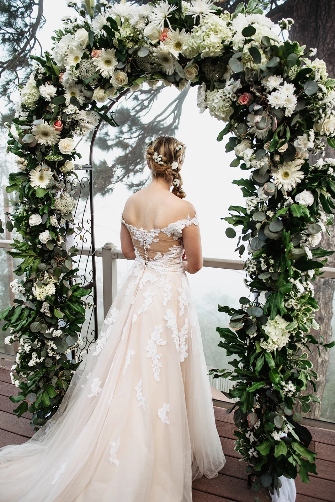 The Sky View Inn Wedding Flower Arch Bride Balcony